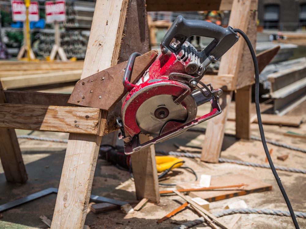A circular saw resting on a sawhorse